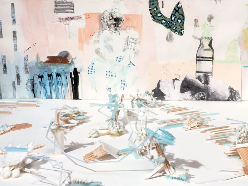 Diorama of q-tip and matchstick constructions before a collaged drawing backdrop